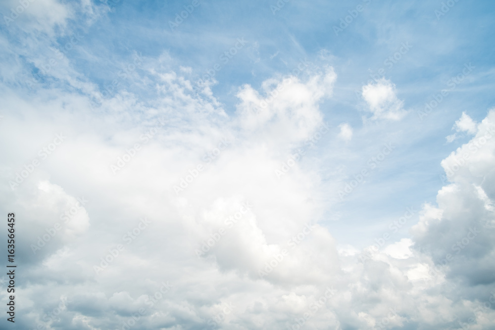 Blue sky with fluffy cloud, natural background.