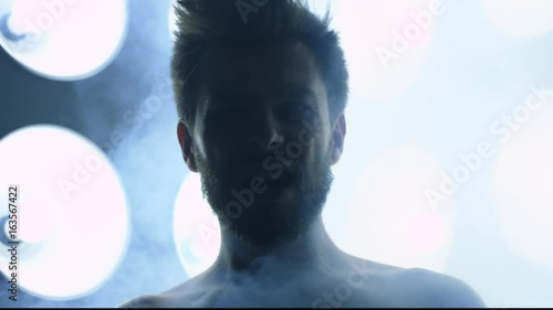 Screaming man in front of big disco lights, Red Epic 120fps slow motion 4k clip
