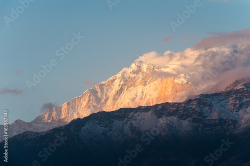 sunlight in the evening is lighting the snow mountain © pnsam