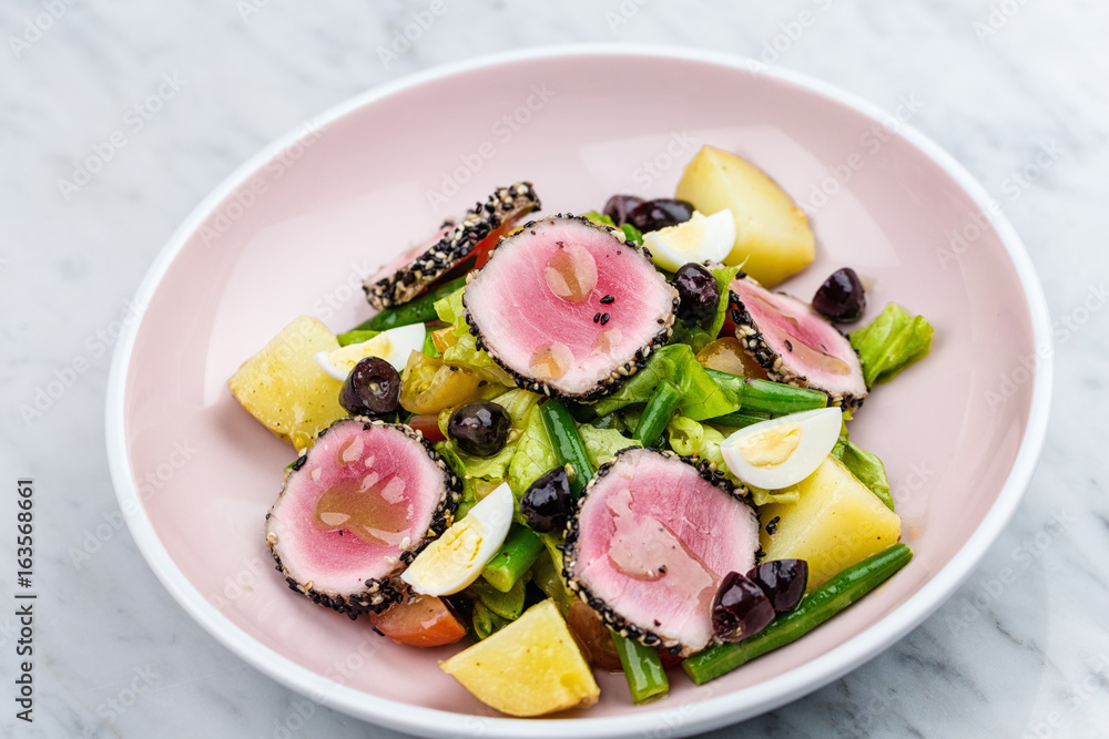Raw and fresh tuna meat with sesame and fresh vegetable salad Raw and fresh tuna meat with sesame and fresh vegetable salad