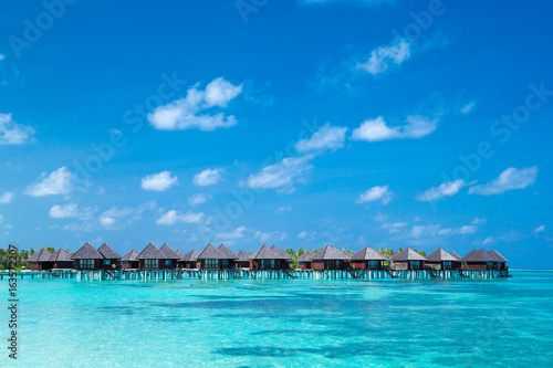 beach with water bungalows at Maldives