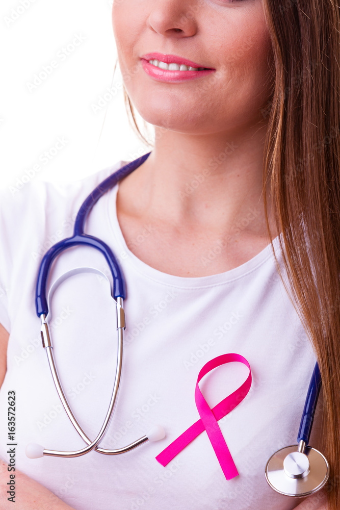 Woman with pink ribbon aids symbol and stethoscope on chest. Woman with pink ribbon aids symbol and stethoscope on chest.