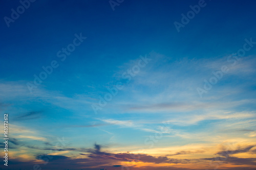 Blue sky background with tiny clouds