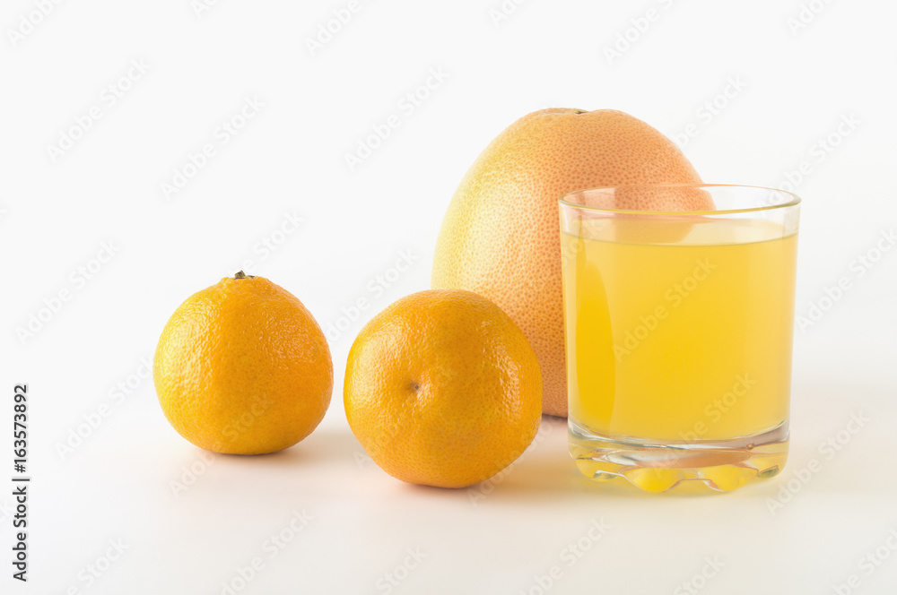 Citrus fruit and juice on isolated background Citrus fruit and juice on isolated background