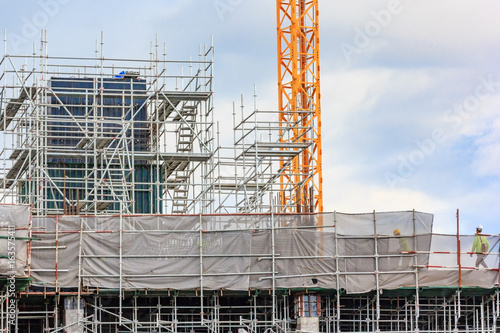 Wallpaper Mural Scaffolding used on construction sites as a platform and as the temporary support. Used by construction workers to do work at height. Torontodigital.ca
