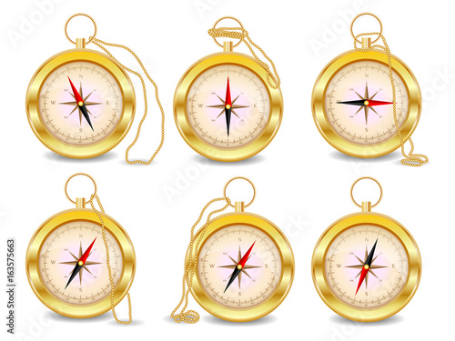 A set of six gold compasses with a wind rose on a gold chain. North, south, west, east, geography, coordinates, directions