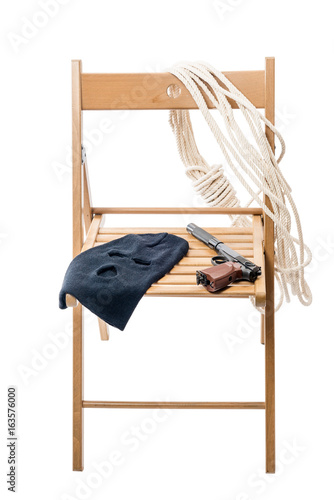 Wooden chair with objects for a hostage on a white background isolated