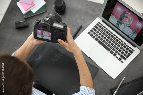 Female photographer with ca...