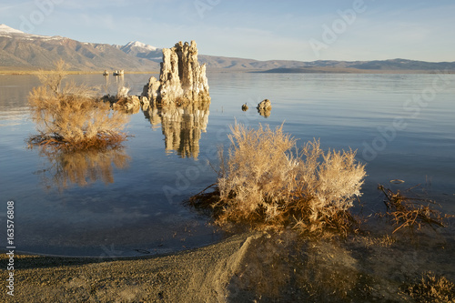 Tufa formations at Mono Lake and the Siera Nevada mountains, Lee Vining, California, USA photo