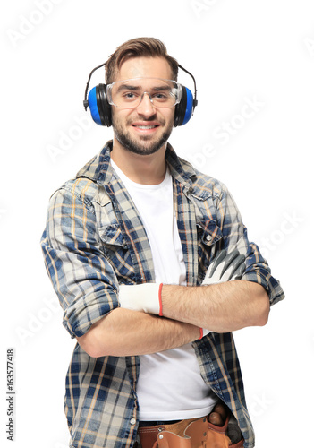 Young smiling carpenter sta...