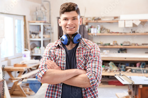 Handsome young carpenter in...
