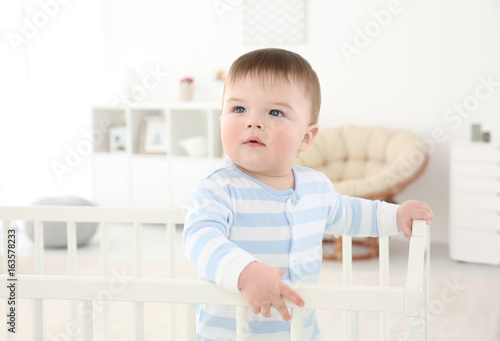 Cute little baby standing i...