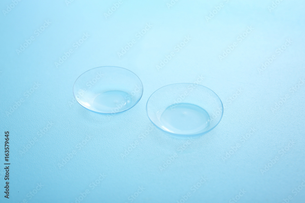 Contact lenses on color background Contact lenses on color background