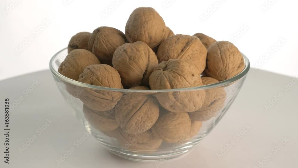 The nut walnut rotates on the turntable. The nut walnut rotates on the turntable.