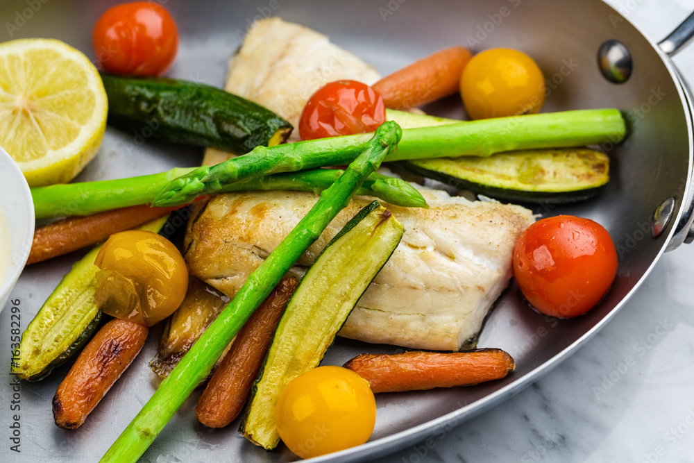 Grilled fish and vegetables with sauce Grilled fish and vegetables with sauce