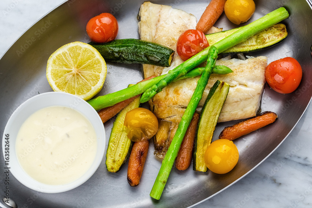 Grilled fish and vegetables with sauce Grilled fish and vegetables with sauce