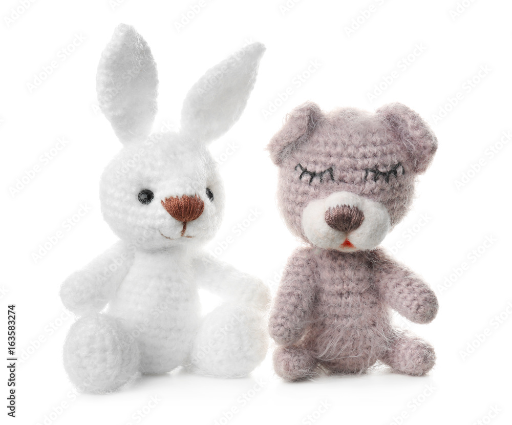 Adorable crochet baby toys isolated on white Adorable crochet baby toys isolated on white