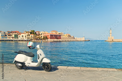 travel image of retro scooter in old greek town