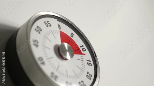 Classical vintage kitchen countdown timer close up, 15 minutes in 20 seconds time lapse shot