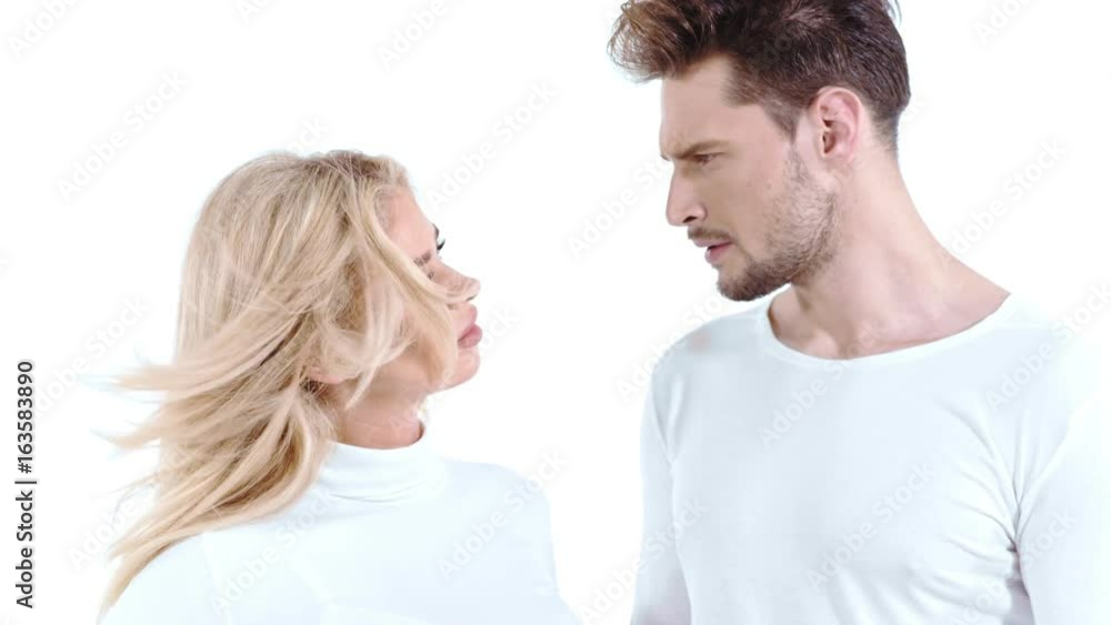 Sexy young couple posing on studio background, 4k slow motion studio clip Sexy young couple posing on studio background, 4k slow motion studio clip