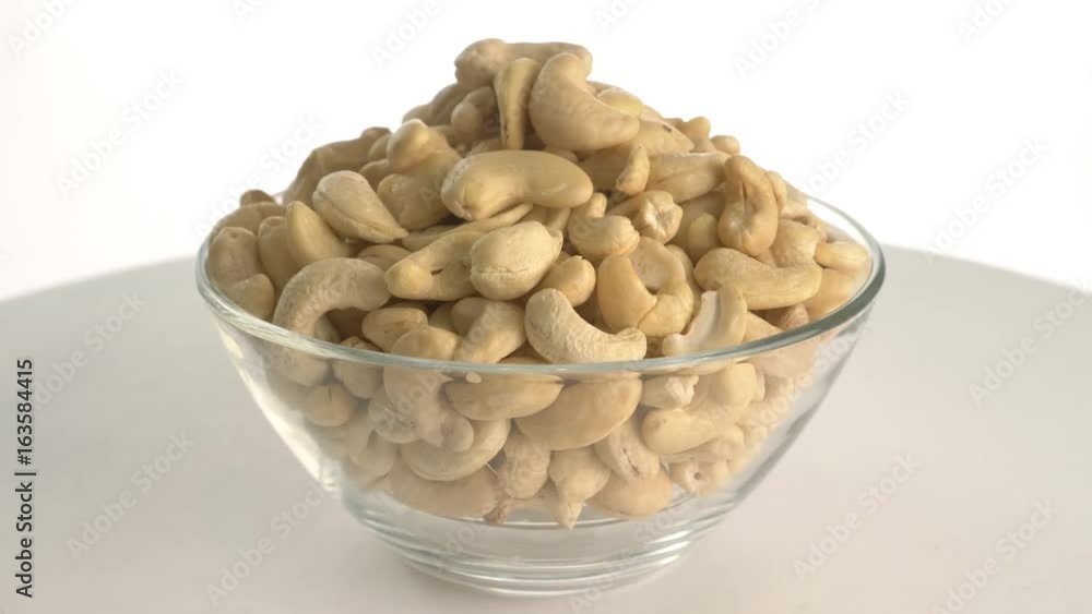 The nut cashew rotates on the turntable. The nut cashew rotates on the turntable.