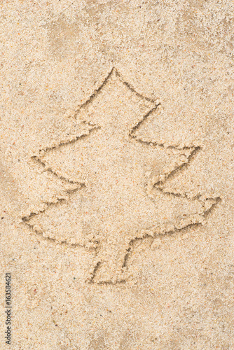 Christmas tree drawing in sand