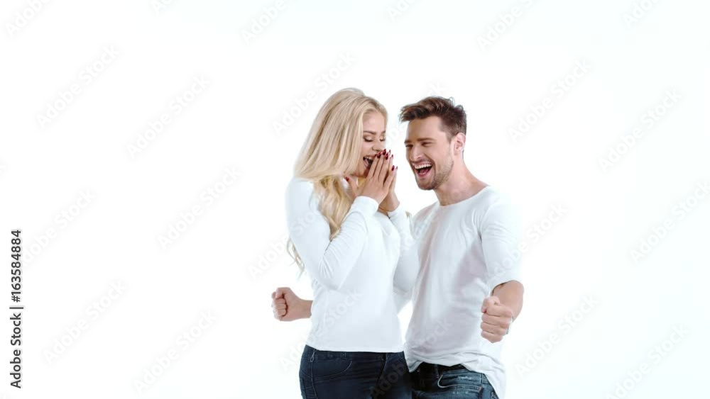 Sexy young couple posing on studio background, 4k slow motion studio clip Sexy young couple posing on studio background, 4k slow motion studio clip