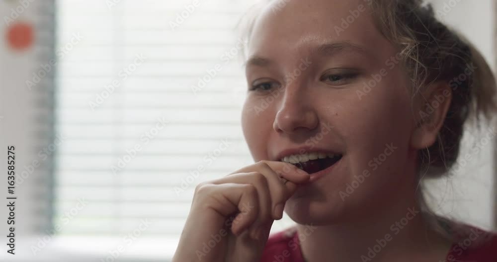 slow motion handheld of teen girl eating cherry slow motion handheld of teen girl eating cherry