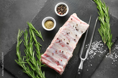 Obraz na plátne Raw ribs with spices on slate plate