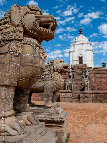 KATHMANDU  BHAKTAPUR  NEPAL  Ancient stone lions and  stone Siddhi Lakshmi Temple in the Durbar square in Bhaktapur.