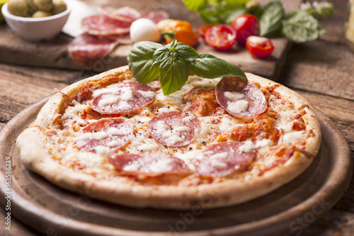 pizza with salami sausage and cheese