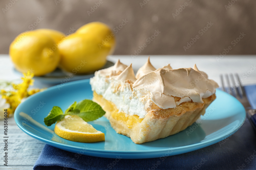 Piece of delicious lemon meringue pie on plate Piece of delicious lemon meringue pie on plate