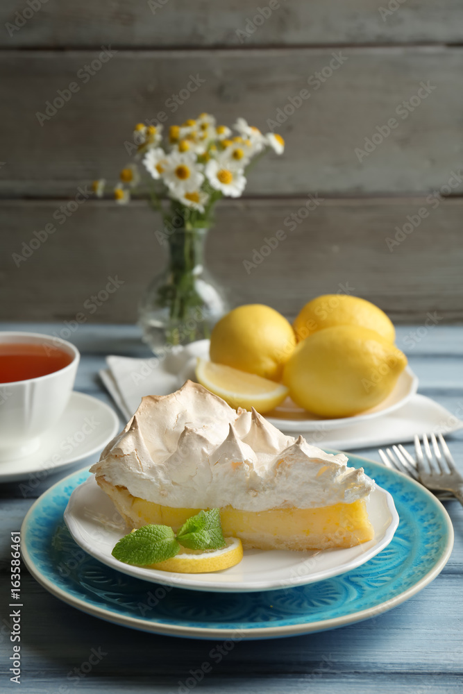 Piece of delicious lemon meringue pie on plate Piece of delicious lemon meringue pie on plate
