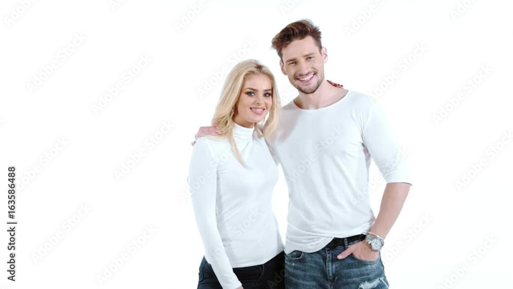Sexy young couple posing on studio background, 4k slow motion studio clip Sexy young couple posing on studio background, 4k slow motion studio clip
