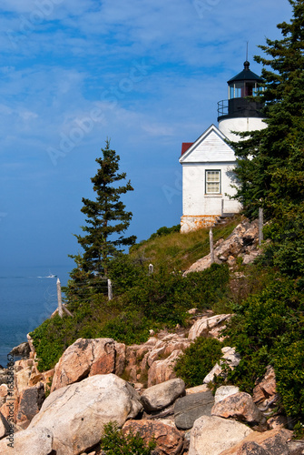Bass Harbor lighthouse over rocky cliffs in Acadia National Park in Maine. © alwoodphoto