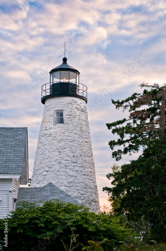 Sunset over Dice Head lighthouse in Castine, Maine, a famous area where many wars were fought for control of this strategic military region. photo