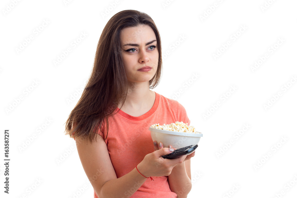 cute girl holds a plate with pop-corn cute girl holds a plate with pop-corn