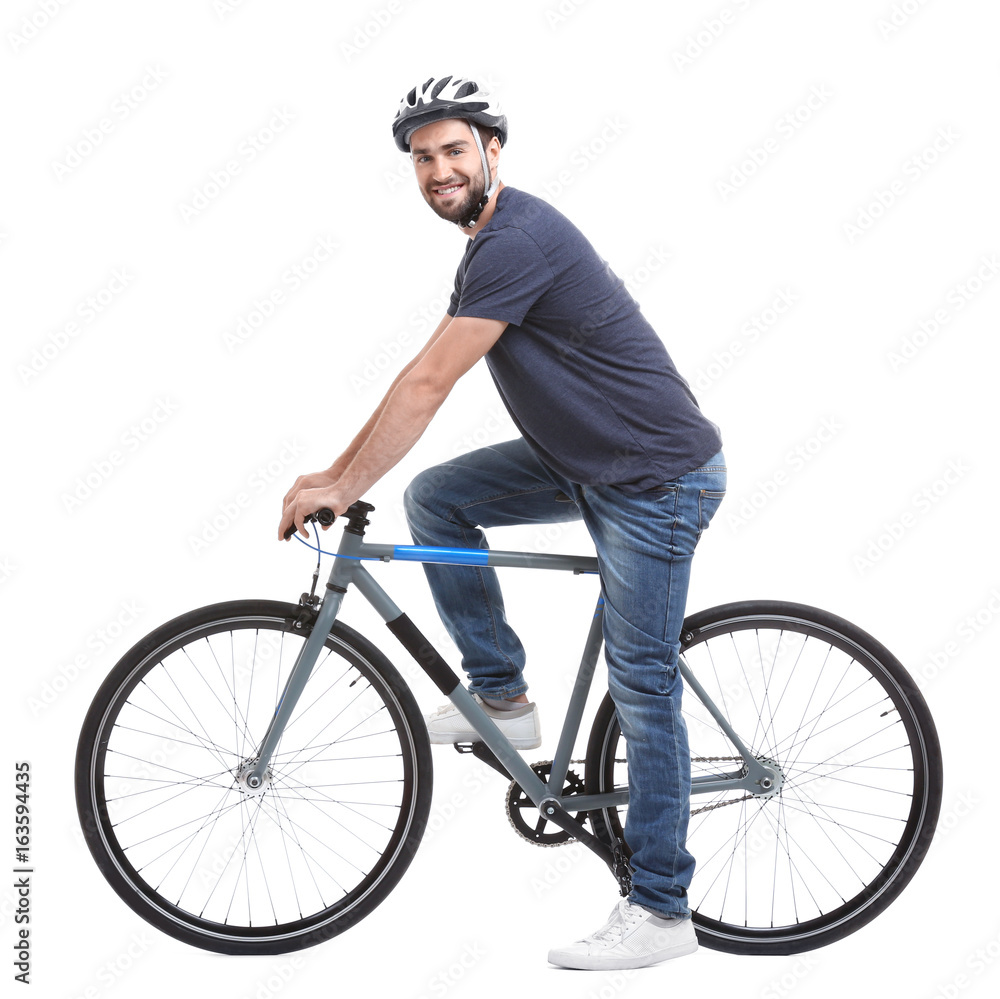 Handsome young man riding bicycle on white background Handsome young man riding bicycle on white background