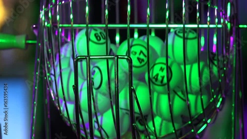 Closeup of bingo balls in a cage
