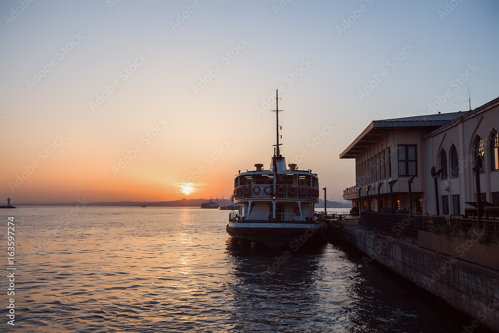 Fototapeta premium Ship in a port at beautiful sundown
