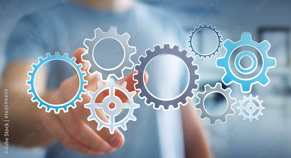Businessman touching hand-drawn gears icons Businessman touching hand-drawn gears icons