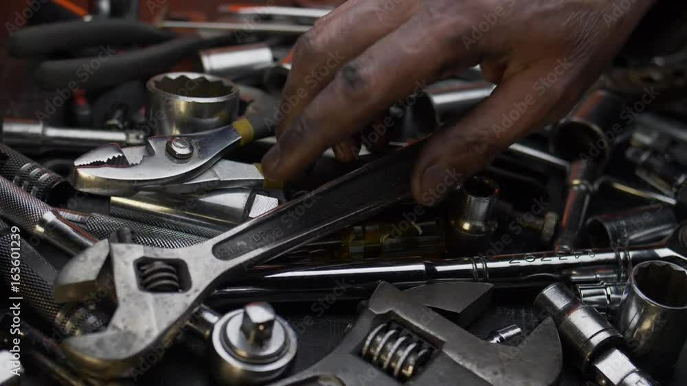 DIRTY HAND CHANGES TOOLS. SLOW MOTION, CLOSE UP DOLLY SHOT. DIRTY HAND CHANGES TOOLS. SLOW MOTION, CLOSE UP DOLLY SHOT.