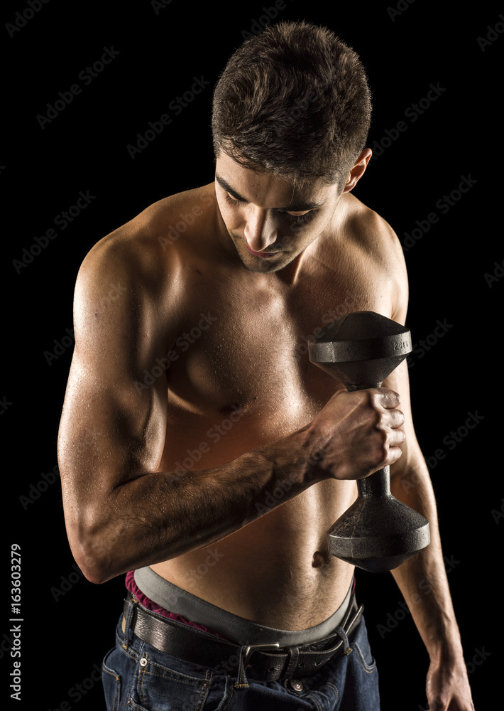 Bodybuilder exercising biceps curl Bodybuilder exercising biceps curl