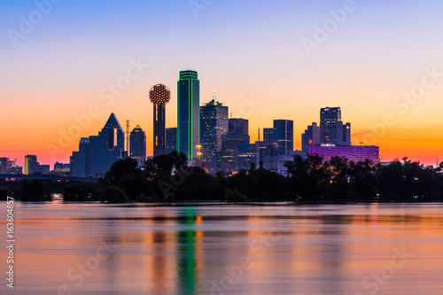 Dallas skyline at sunrise with water reflections photo