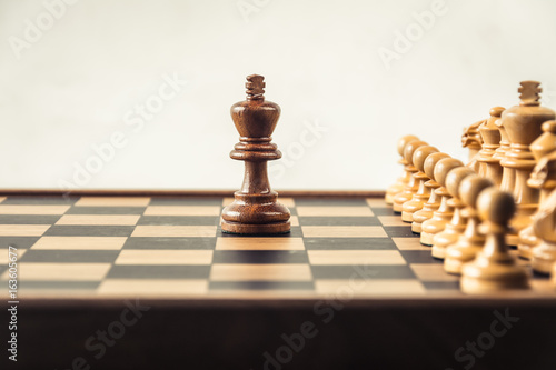 Chess on board white backgroung. Confrontation concept