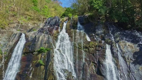 Close Panorama Fantastic Waterfall Streams at Bright Sunlight photo