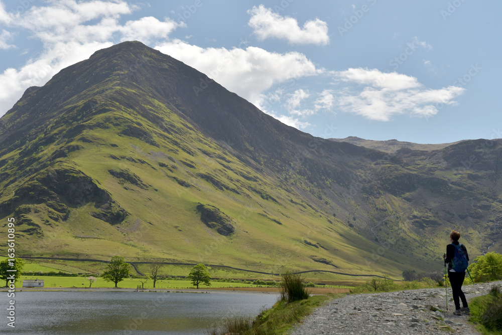 Walker on Buttermere shore path, English Lake District
