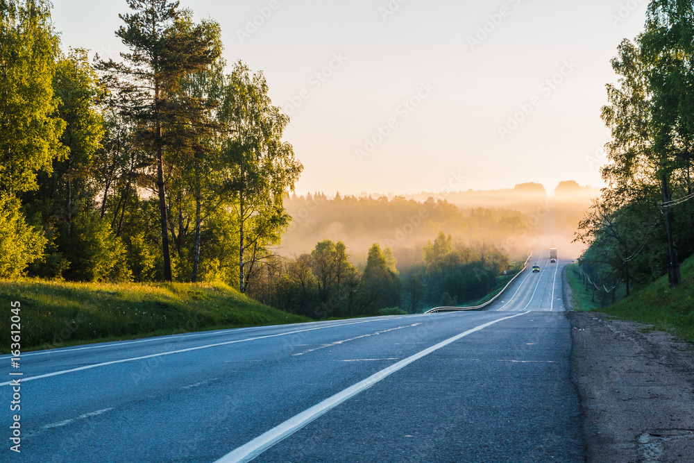 Road in the early morning and fog