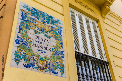 Ceramic tiles street sign of the Manises square in Valencia photo