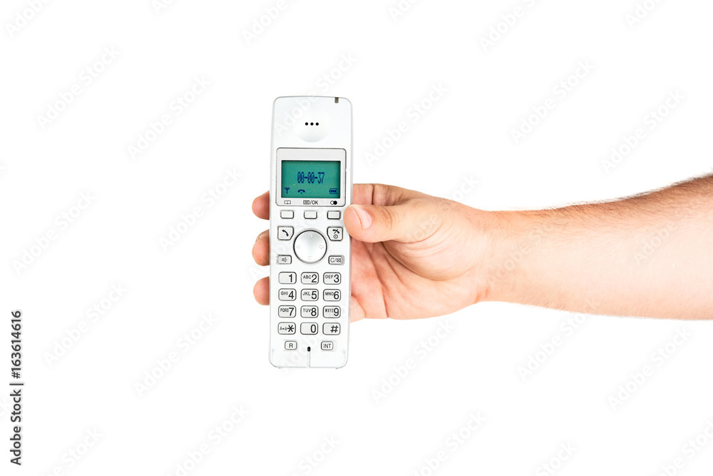 Hand Holding Home Wireless Phone Isolated On White Background Hand Holding Home Wireless Phone Isolated On White Background